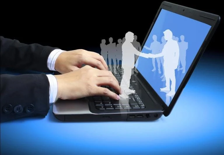 Illustration of remote communication using a laptop and human silhouettes
